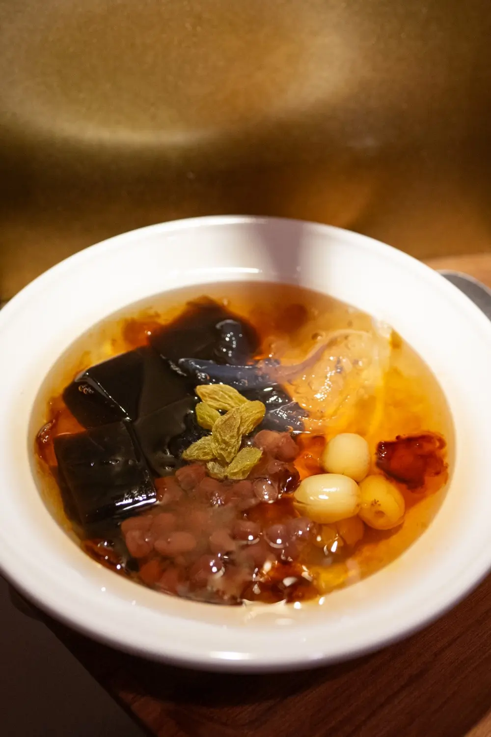 A combination of peach resin, grass jelly, and other ingredients, rich in taste at Sweet Newbie,a Dessert Shop in Chicago