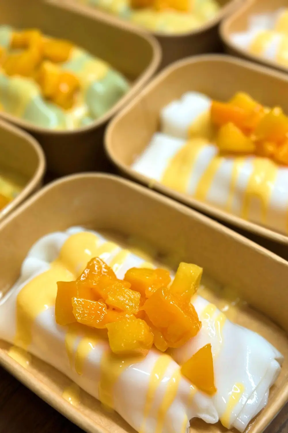 Rice noodle roll filled with fresh mango, sweet and soft at Sweet Newbie,a Dessert Shop in Chicago